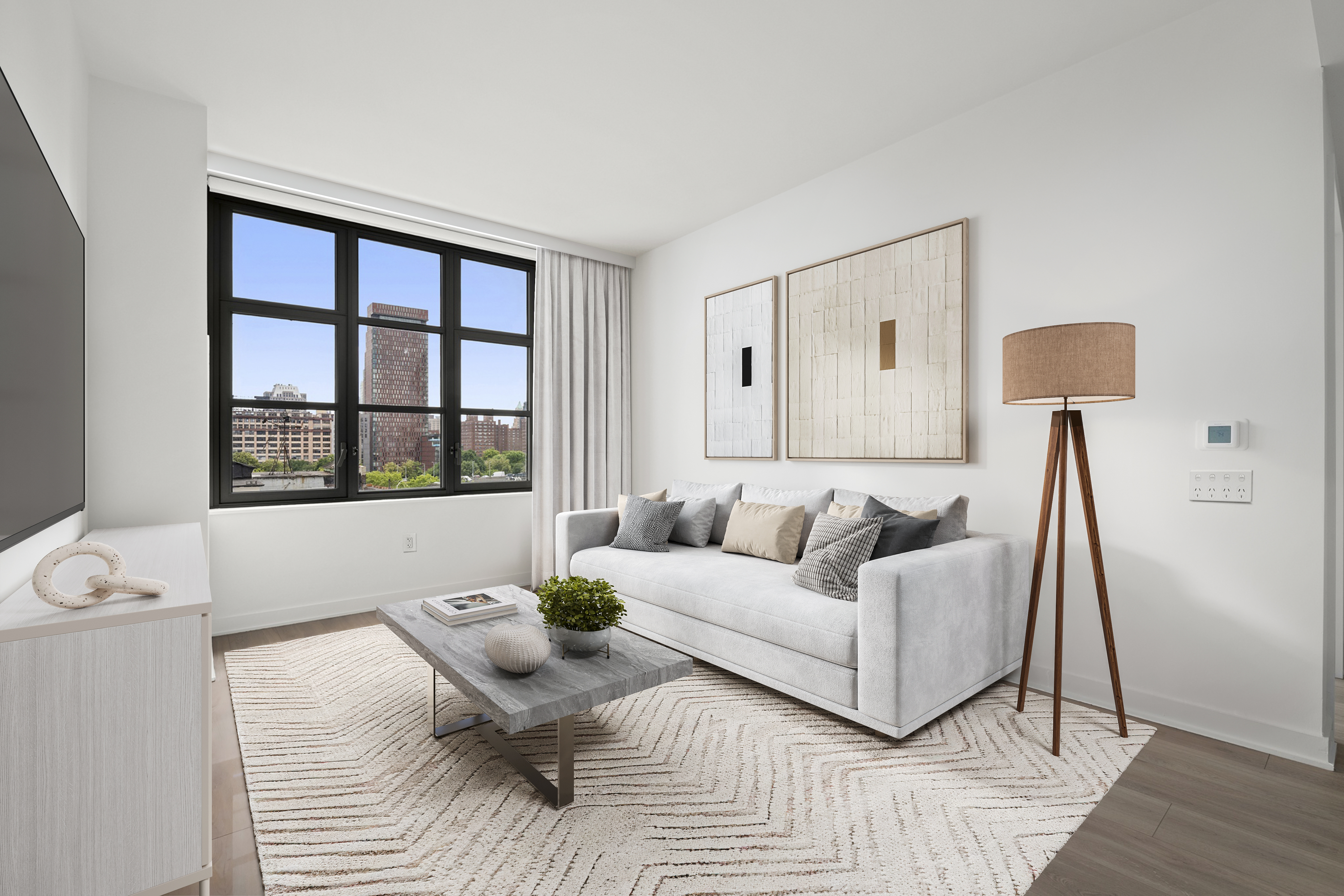 a living room with furniture and a large window