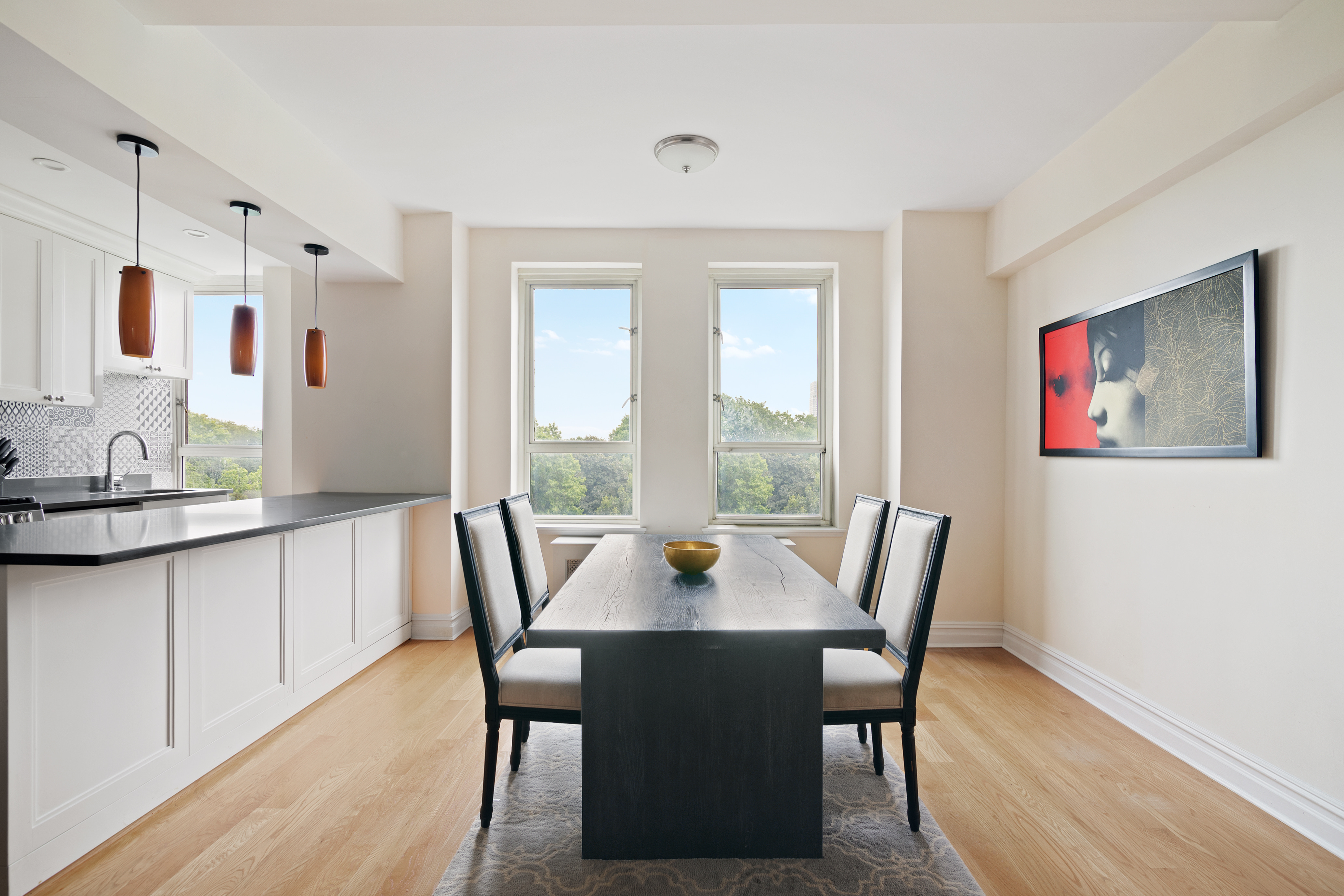 a view of a dining room with furniture window and outside view