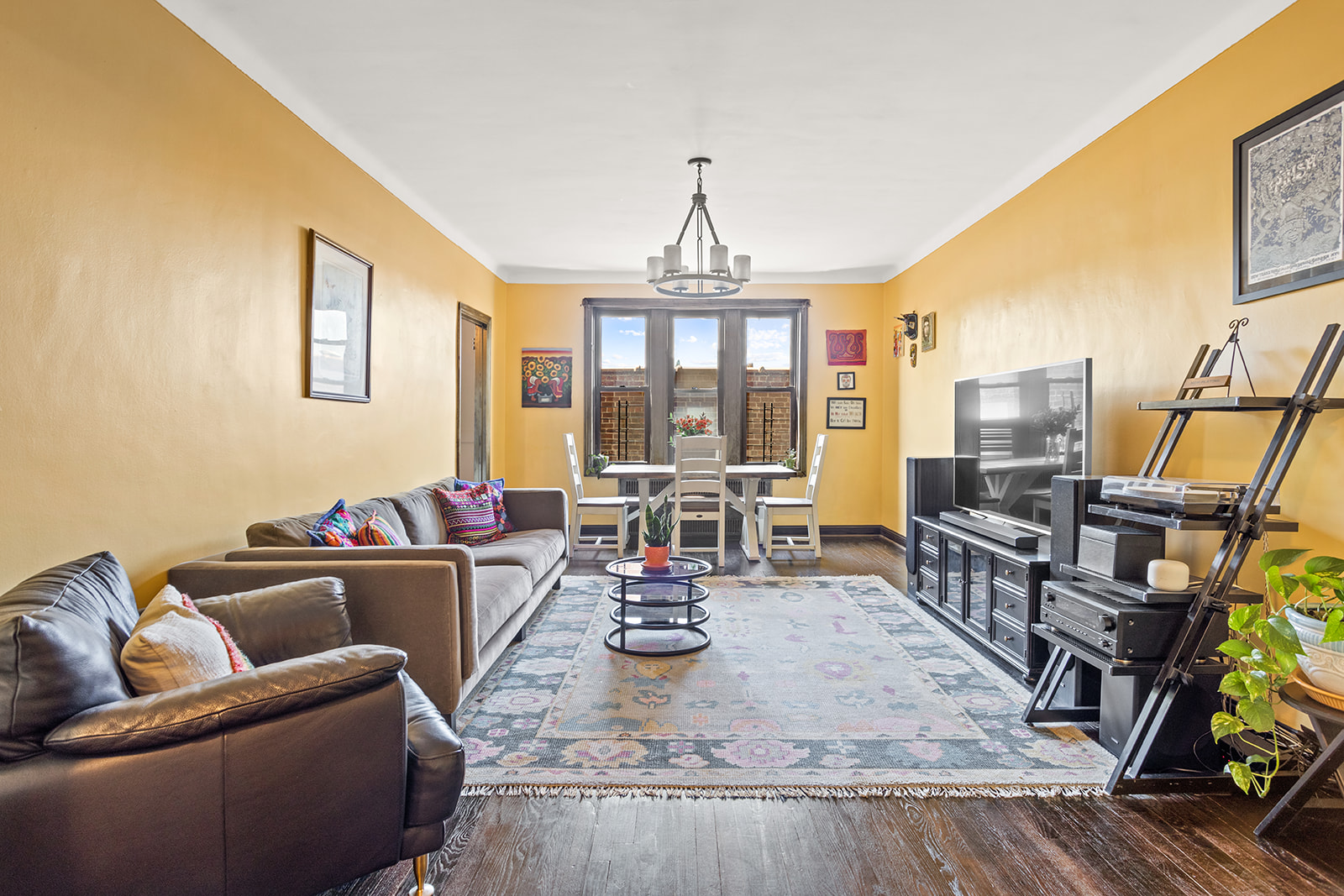 a living room with fireplace furniture and a flat screen tv