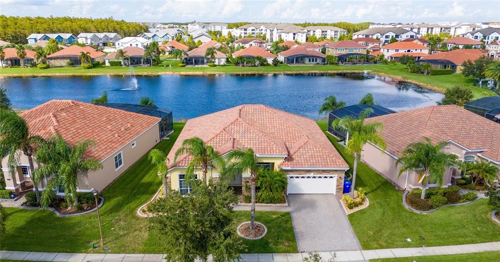 an aerial view of house with yard swimming pool and outdoor seating