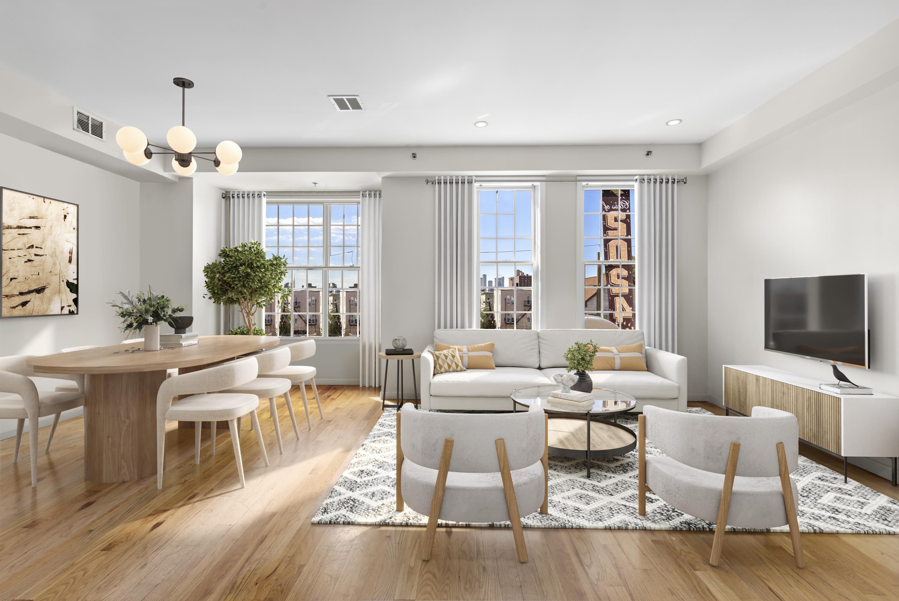 a living room with furniture a chandelier and a flat screen tv