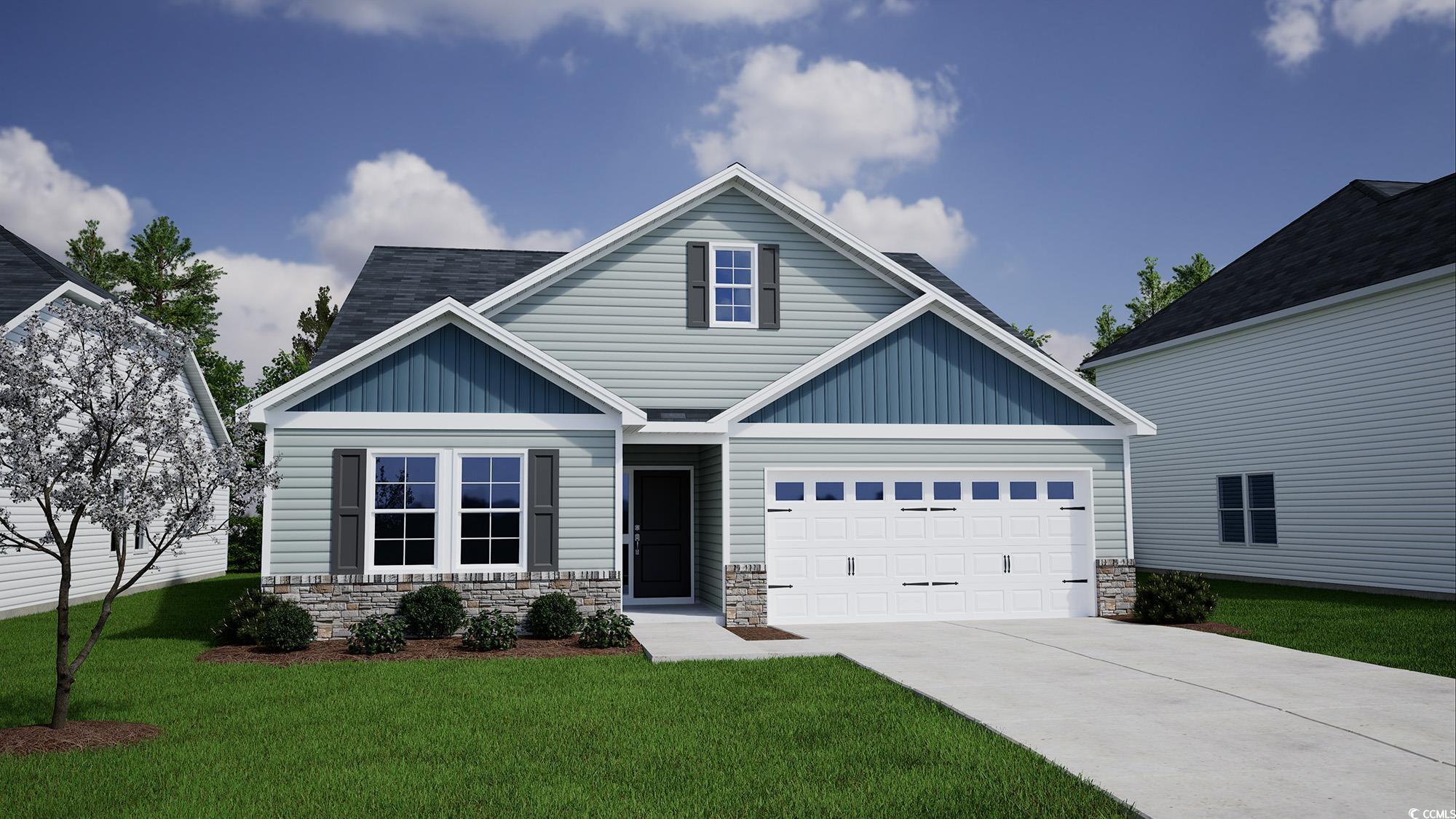 Craftsman house featuring a front yard and a garag