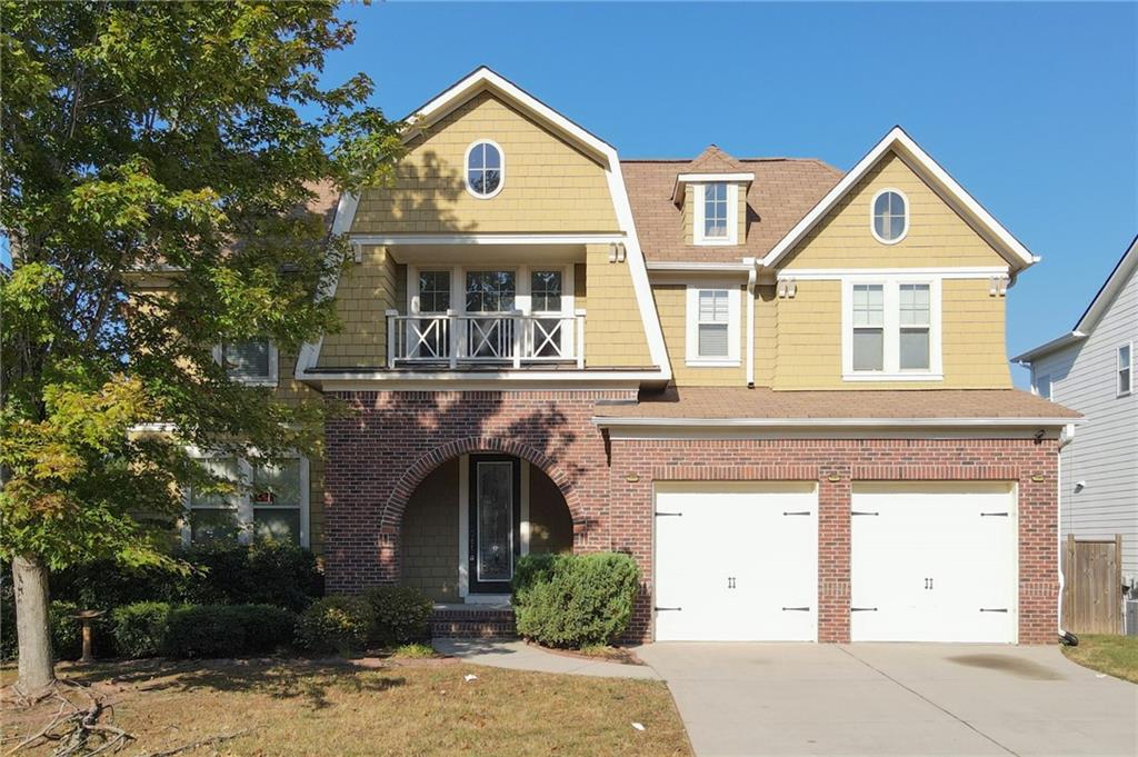 front view of a house with a yard