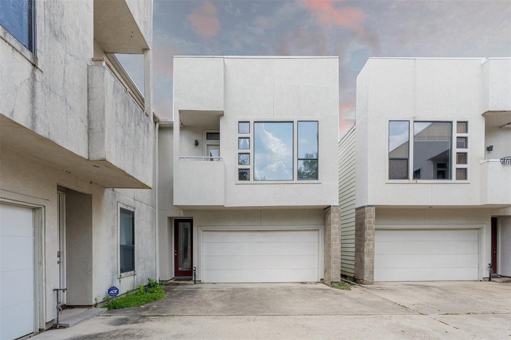 a front view of a building with a garage