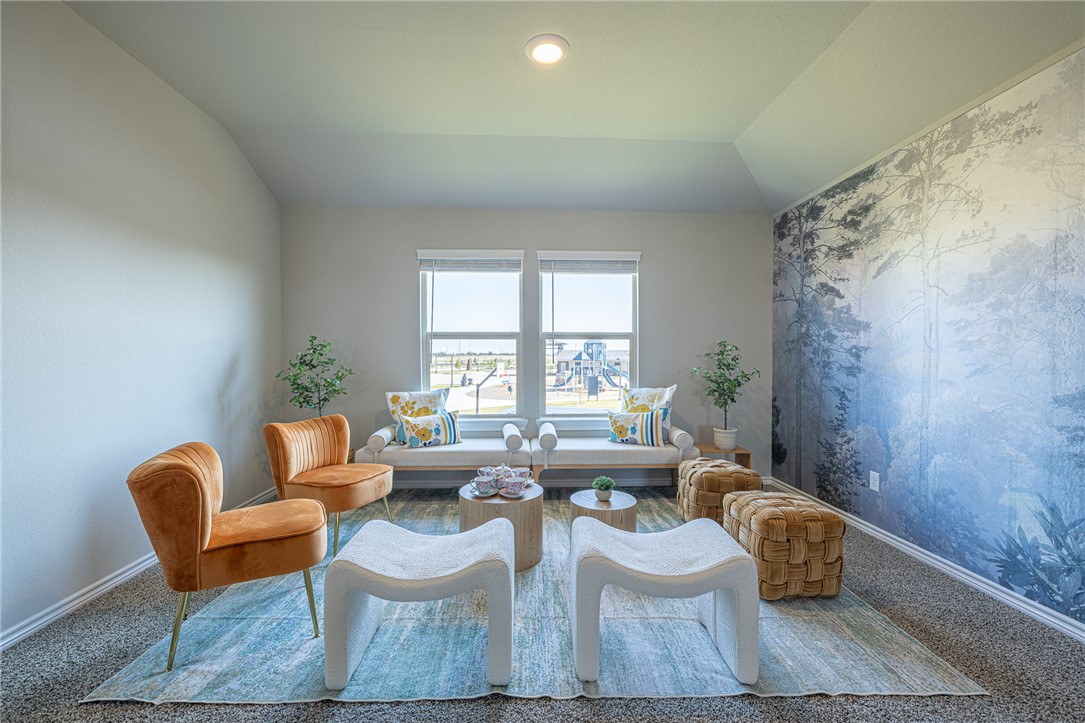 a living room with furniture and a rug