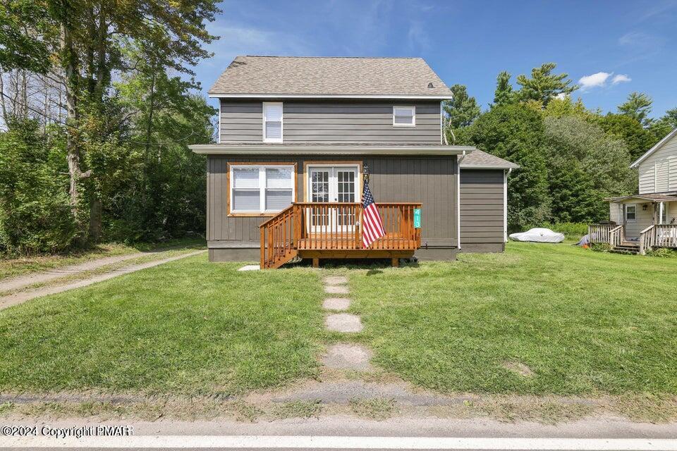 a front view of a house with a yard