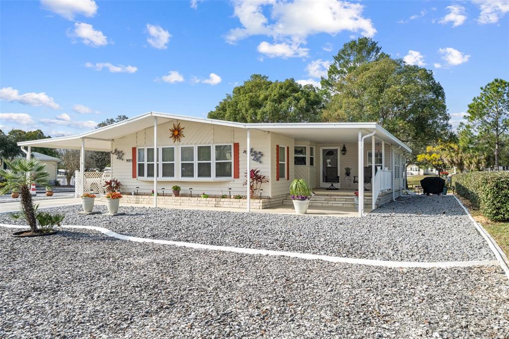 a view of a house with a yard from a patio