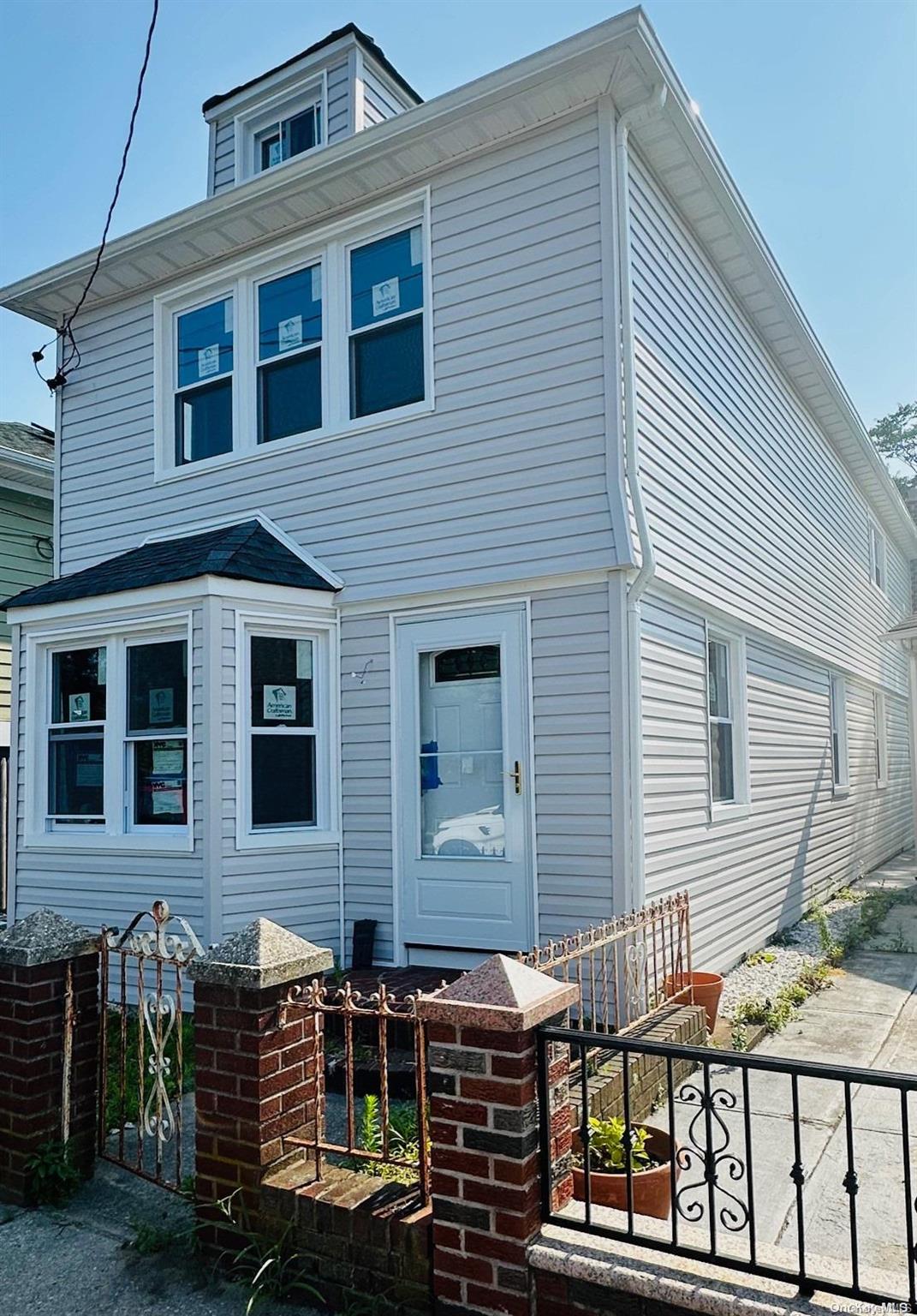 a front view of a house with balcony