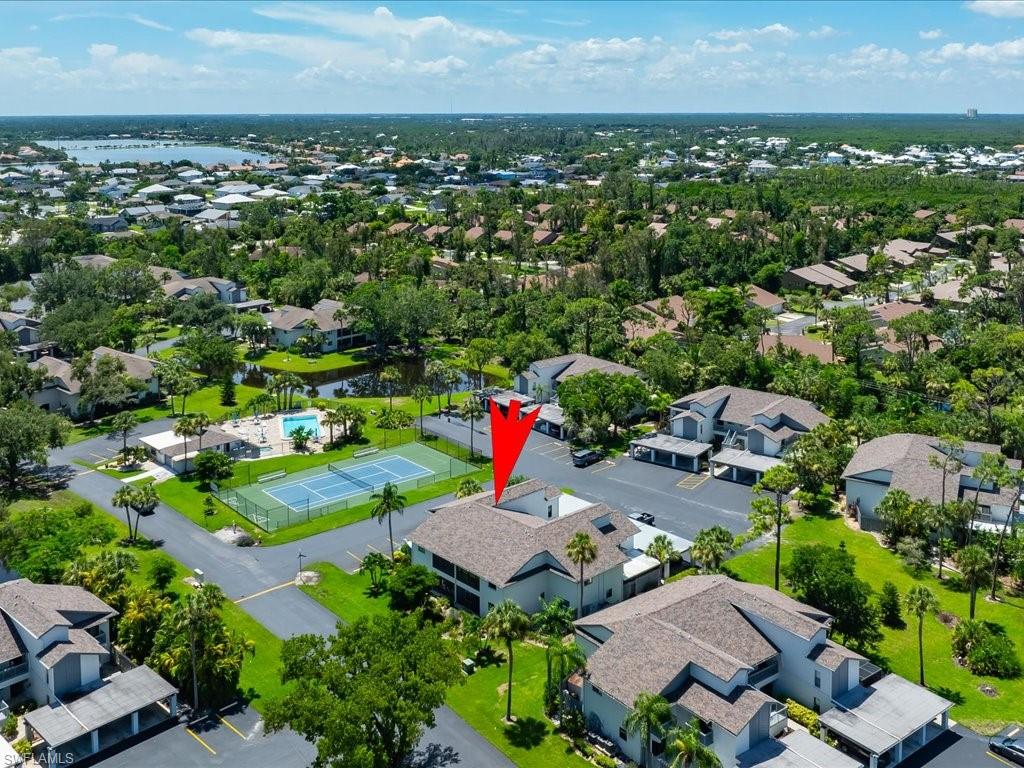 an aerial view of a houses with a yard