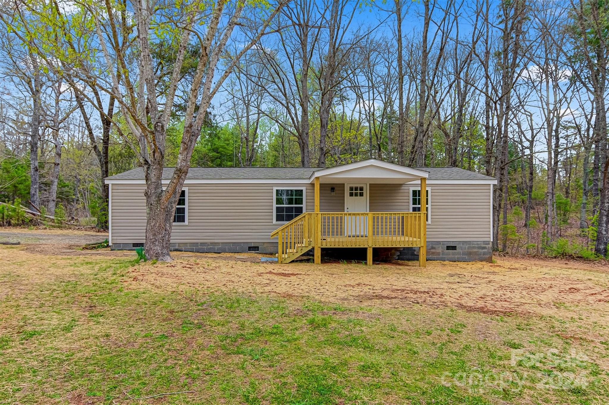 a backyard of a house with yard and trees