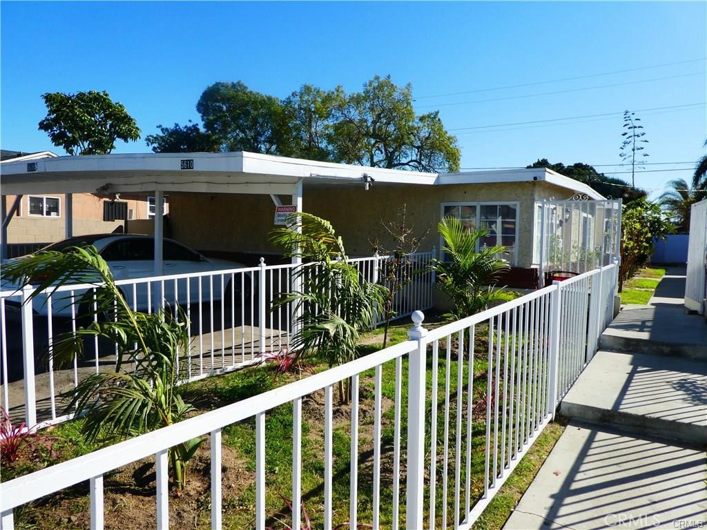 a view of a house with wooden deck