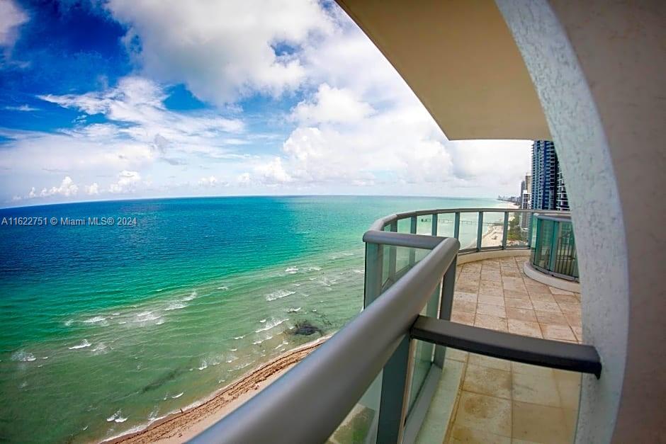 a view of swimming pool from a balcony