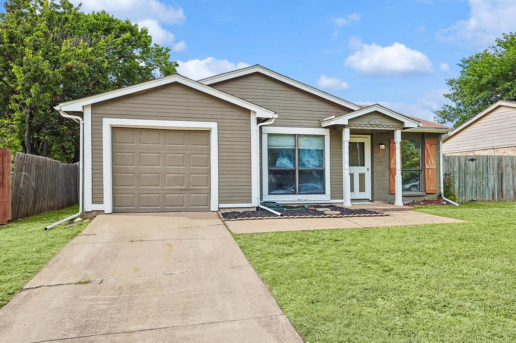 front view of a house with a yard