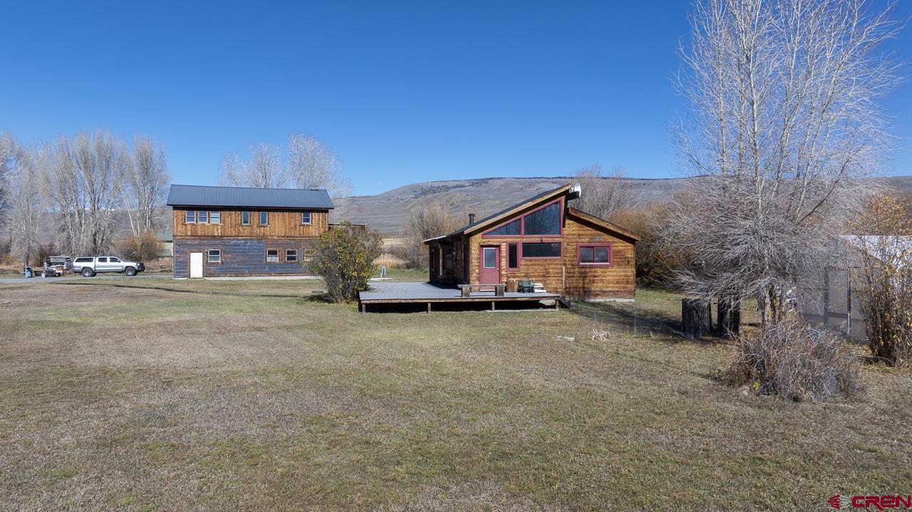 a view of a house with a yard