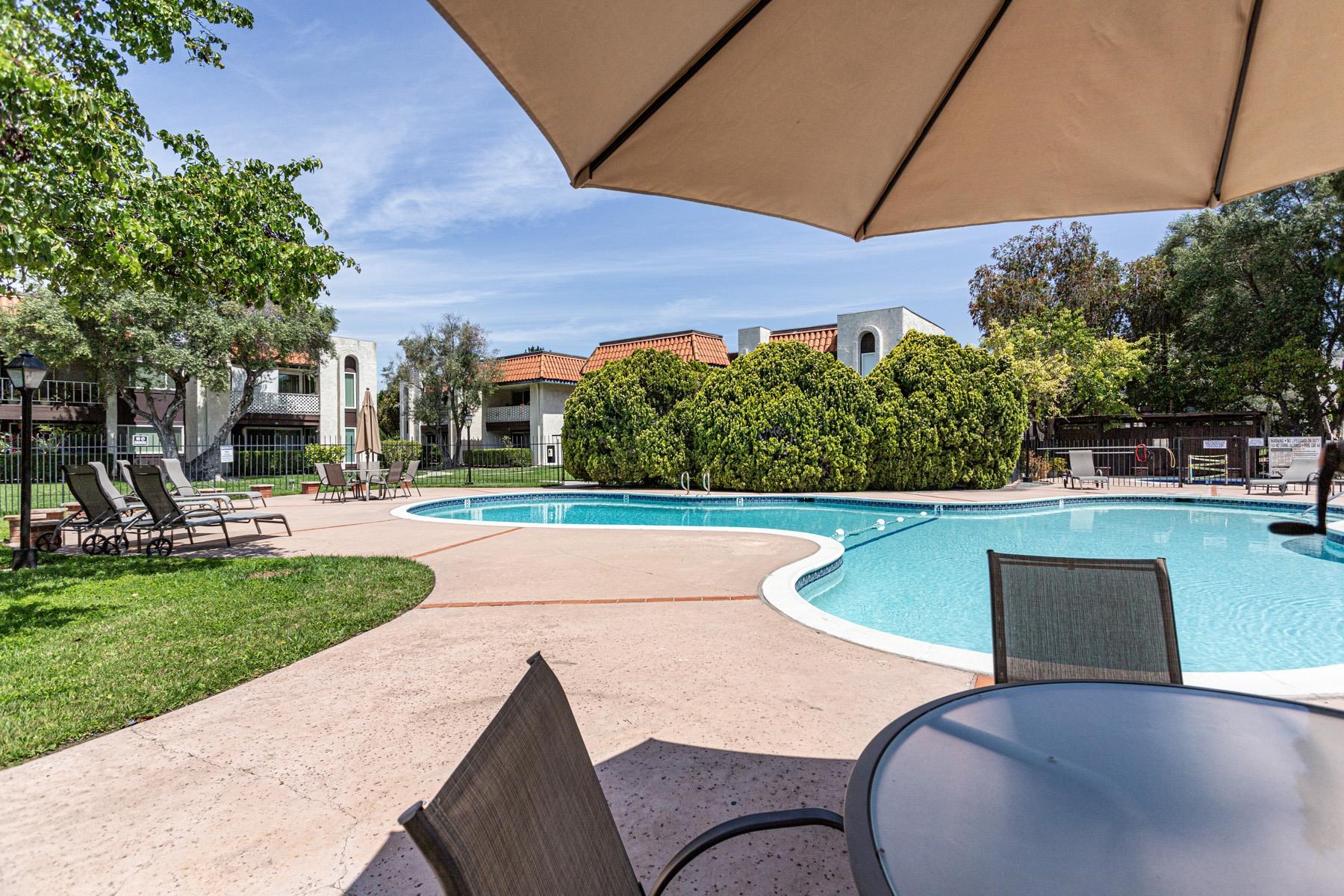 a view of a swimming pool with a patio