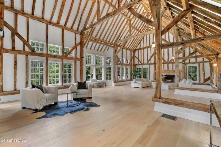 a living room with furniture and large windows