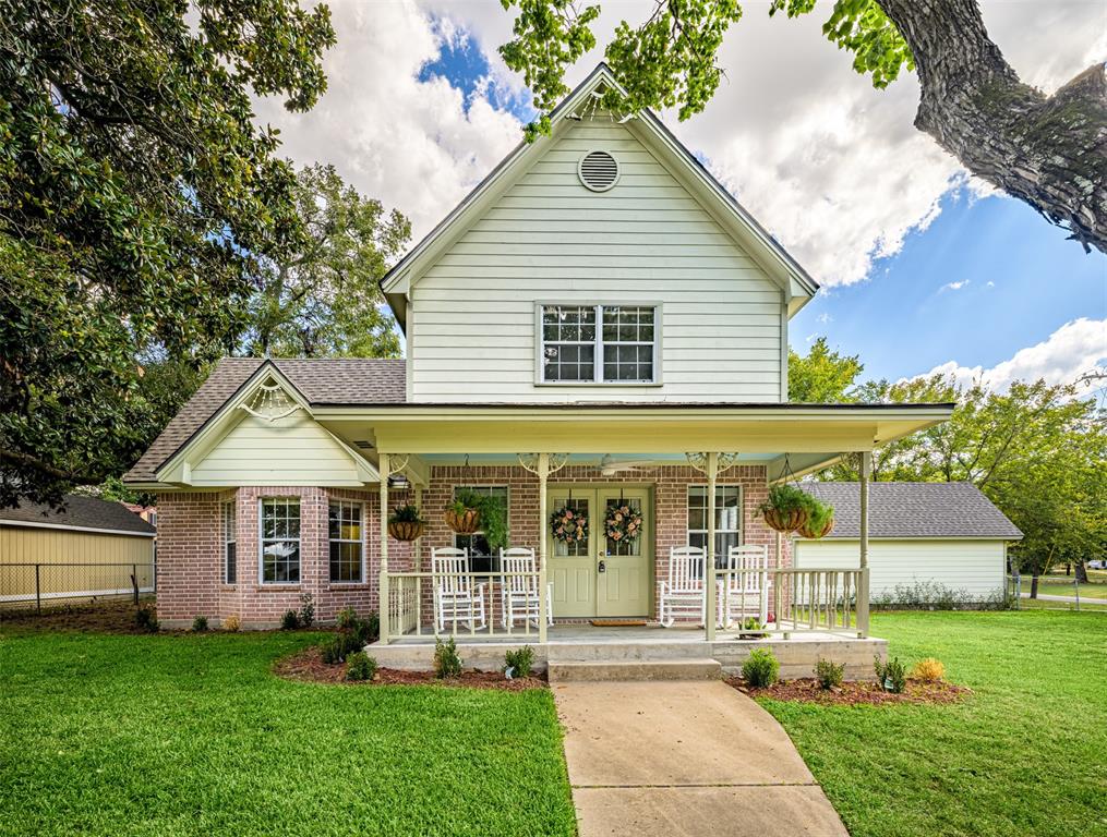 front view of a house with a yard