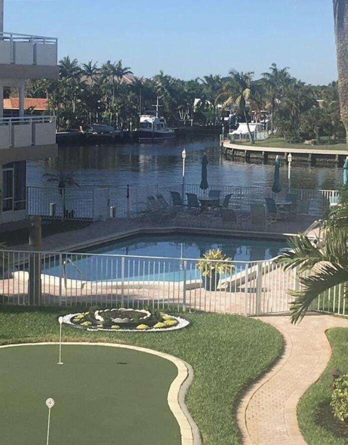 a view of a swimming pool with a lake view