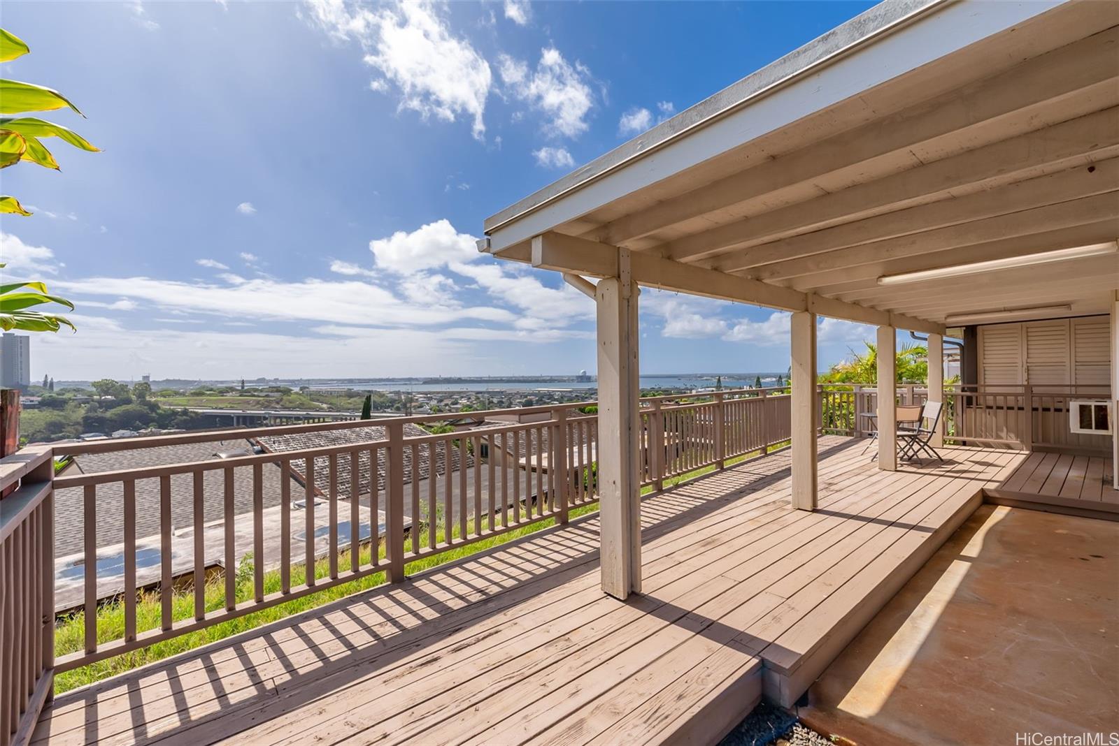 a view of a balcony with wooden floor