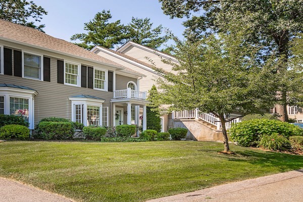 a front view of a house with garden