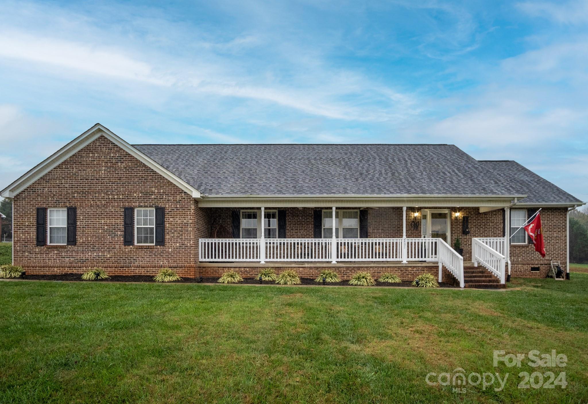 front view of a house with a yard