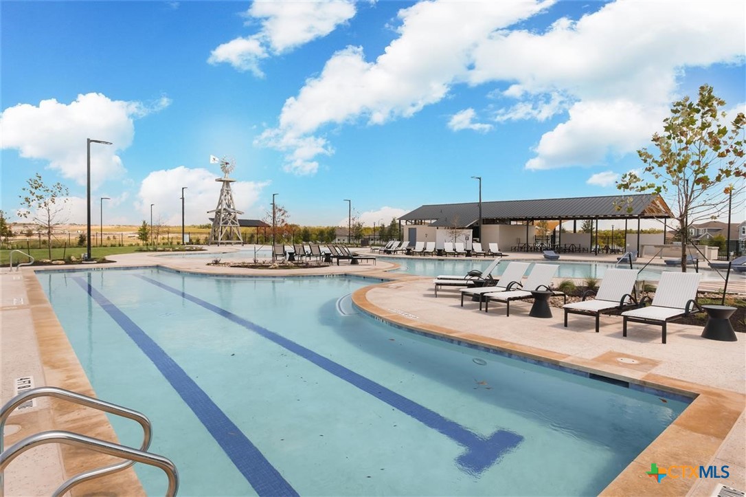 view of a swimming pool and outdoor seating