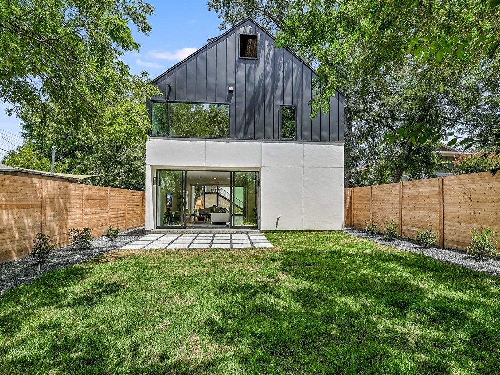 a view of a backyard with a small cabin and a chair