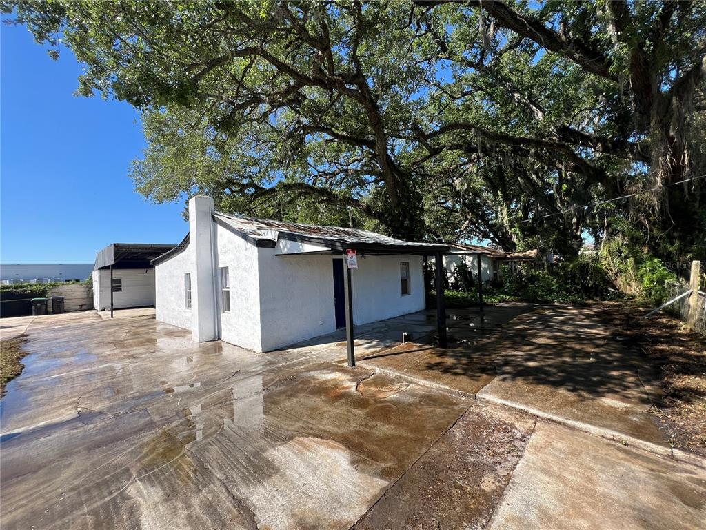 a view of a house with a tree