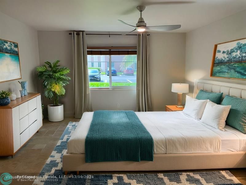 a bedroom with a bed and a potted plant