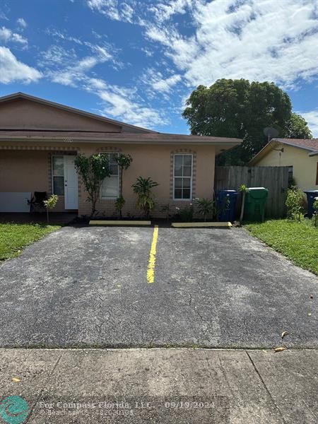 Exterior of home with two parking lots