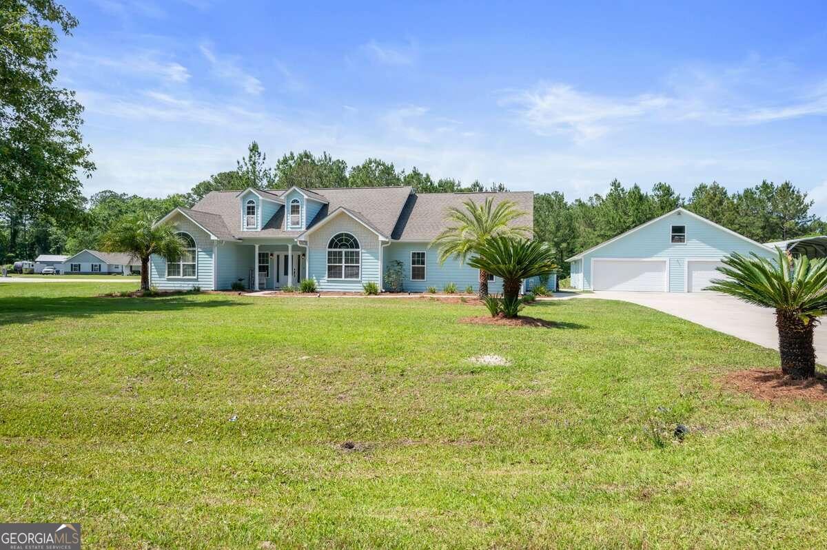 a view of a house with a yard