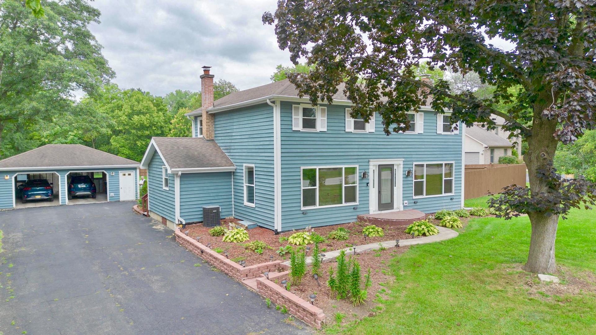 front view of a house with a yard