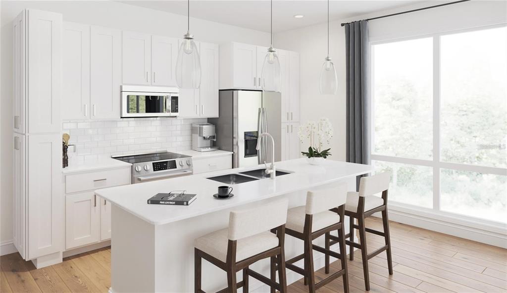 a white kitchen with a table chairs and a refrigerator