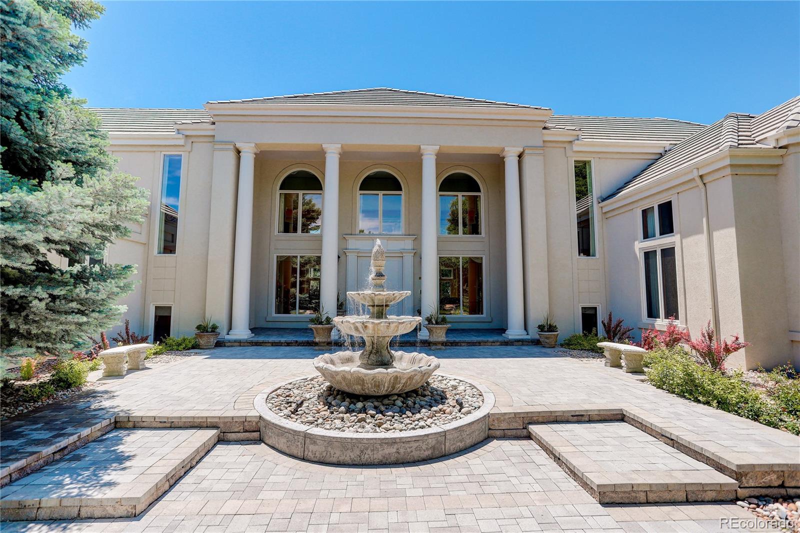 a front view of a house with a yard patio and fire pit