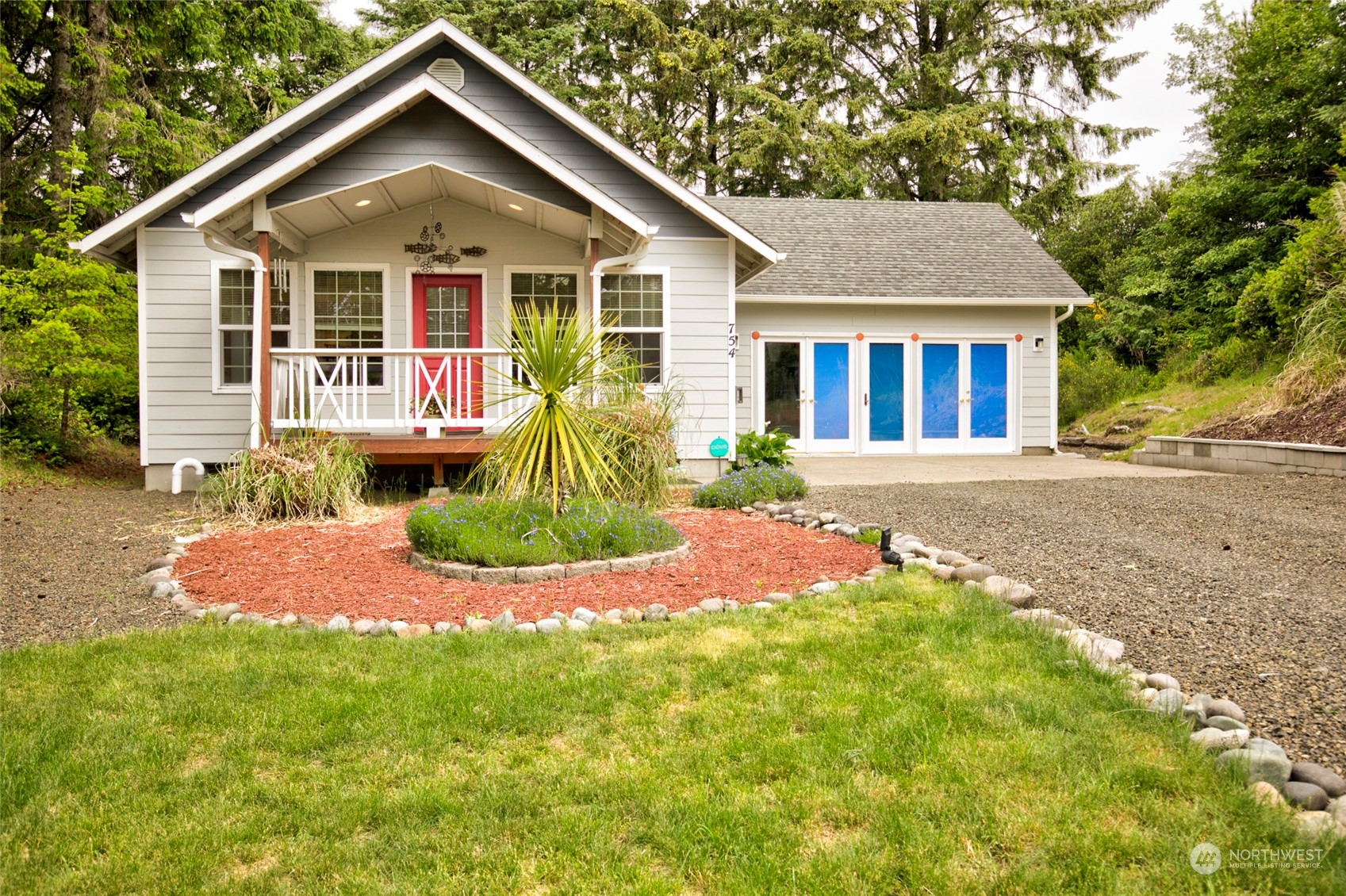 a front view of a house with a yard and porch