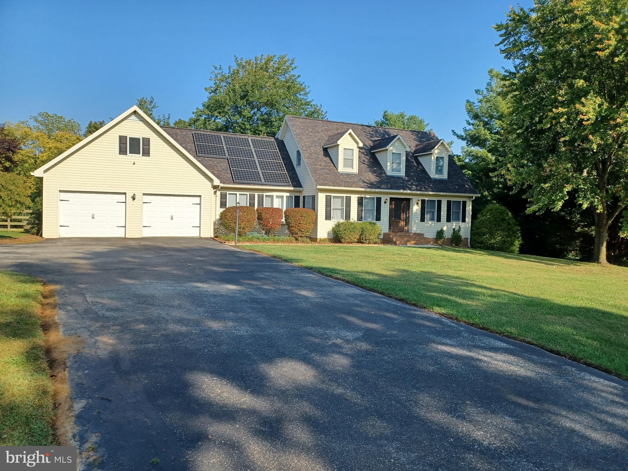 a view of front of house with a yard