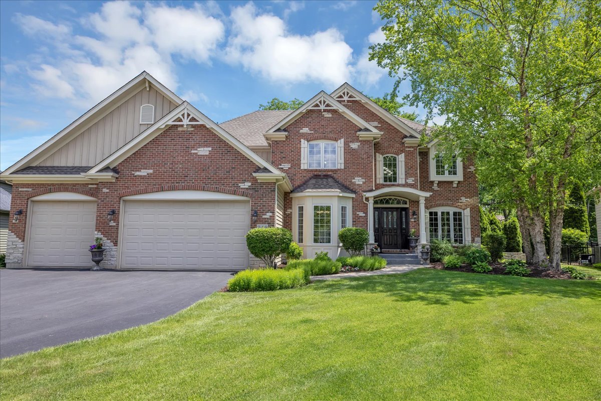 front view of a house with a yard