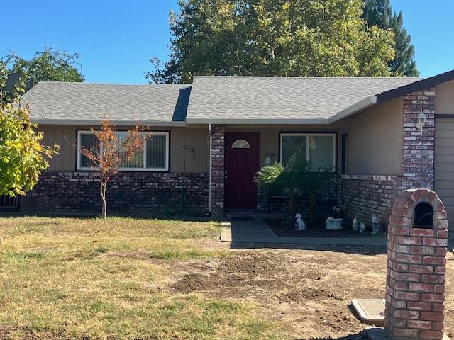 front view of a house with a yard