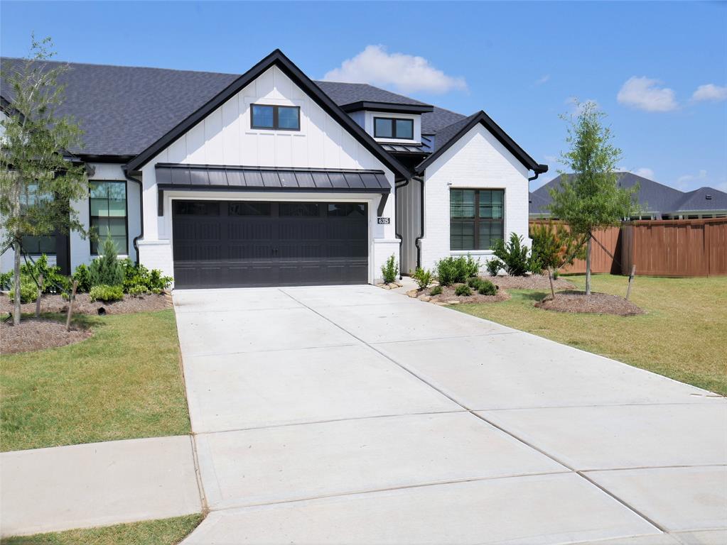 a front view of a house with yard