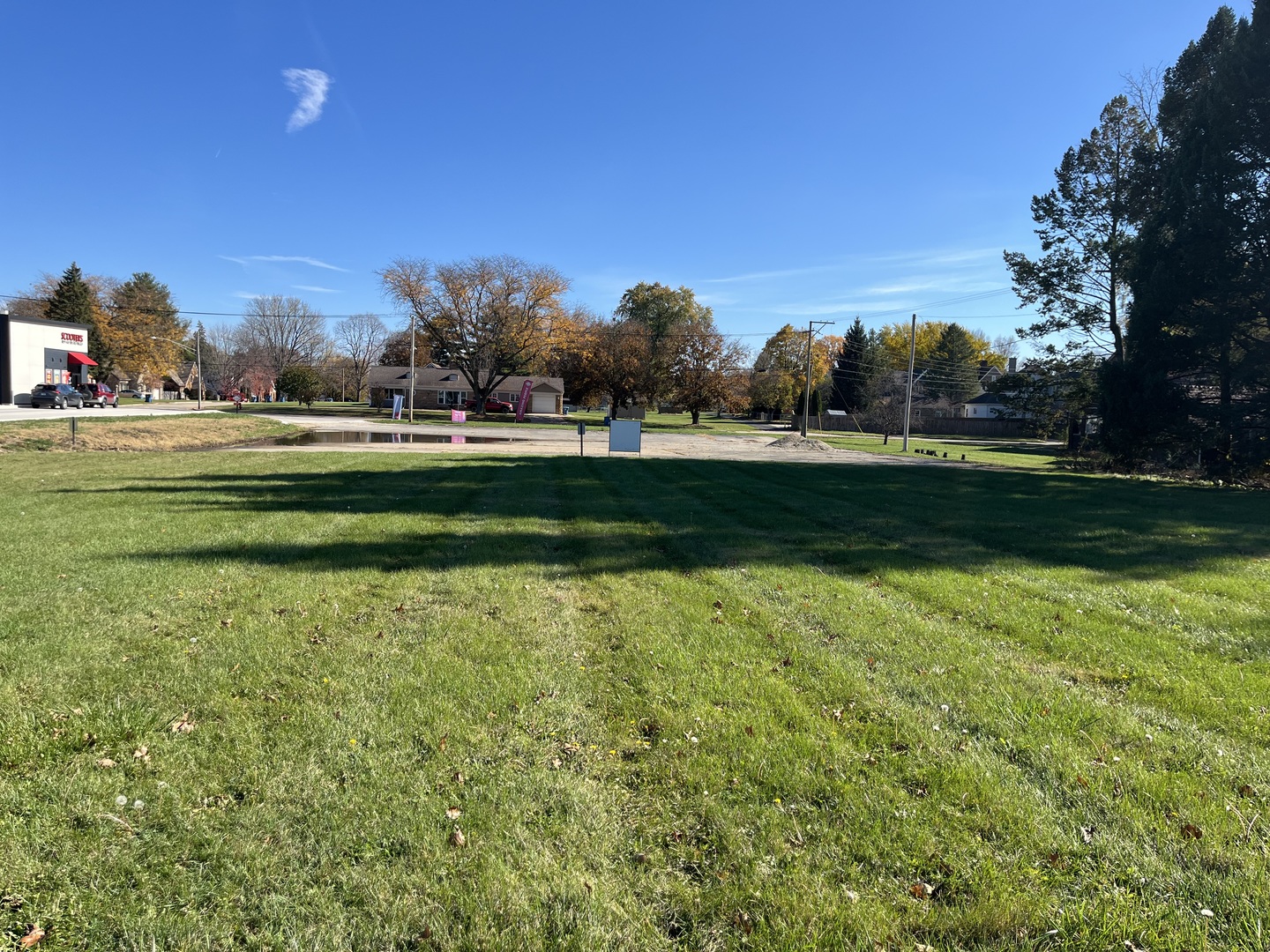 a view of a golf course with a lake view