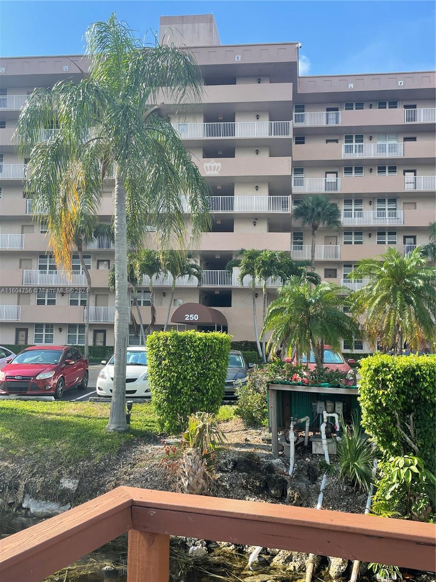 a front view of a building with garden