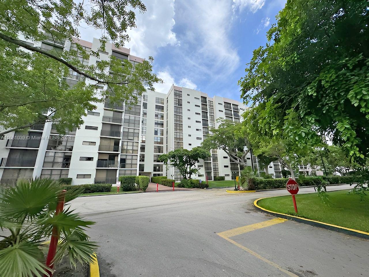 a front view of a building with garden