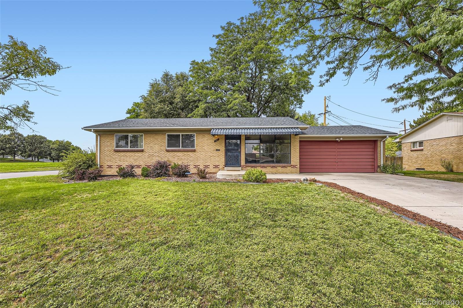 a view of a house with a back yard