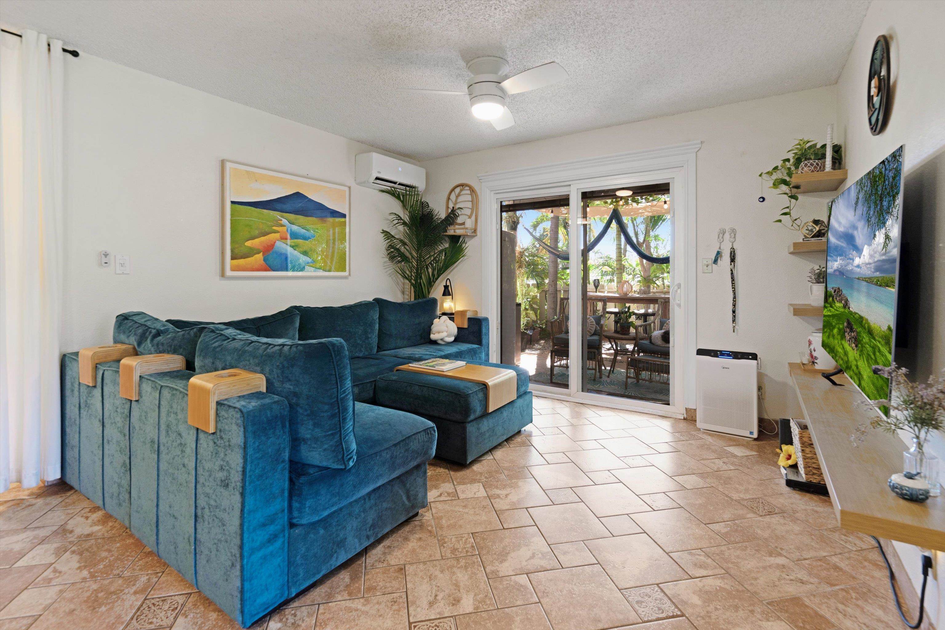 a living room with furniture and a flat screen tv