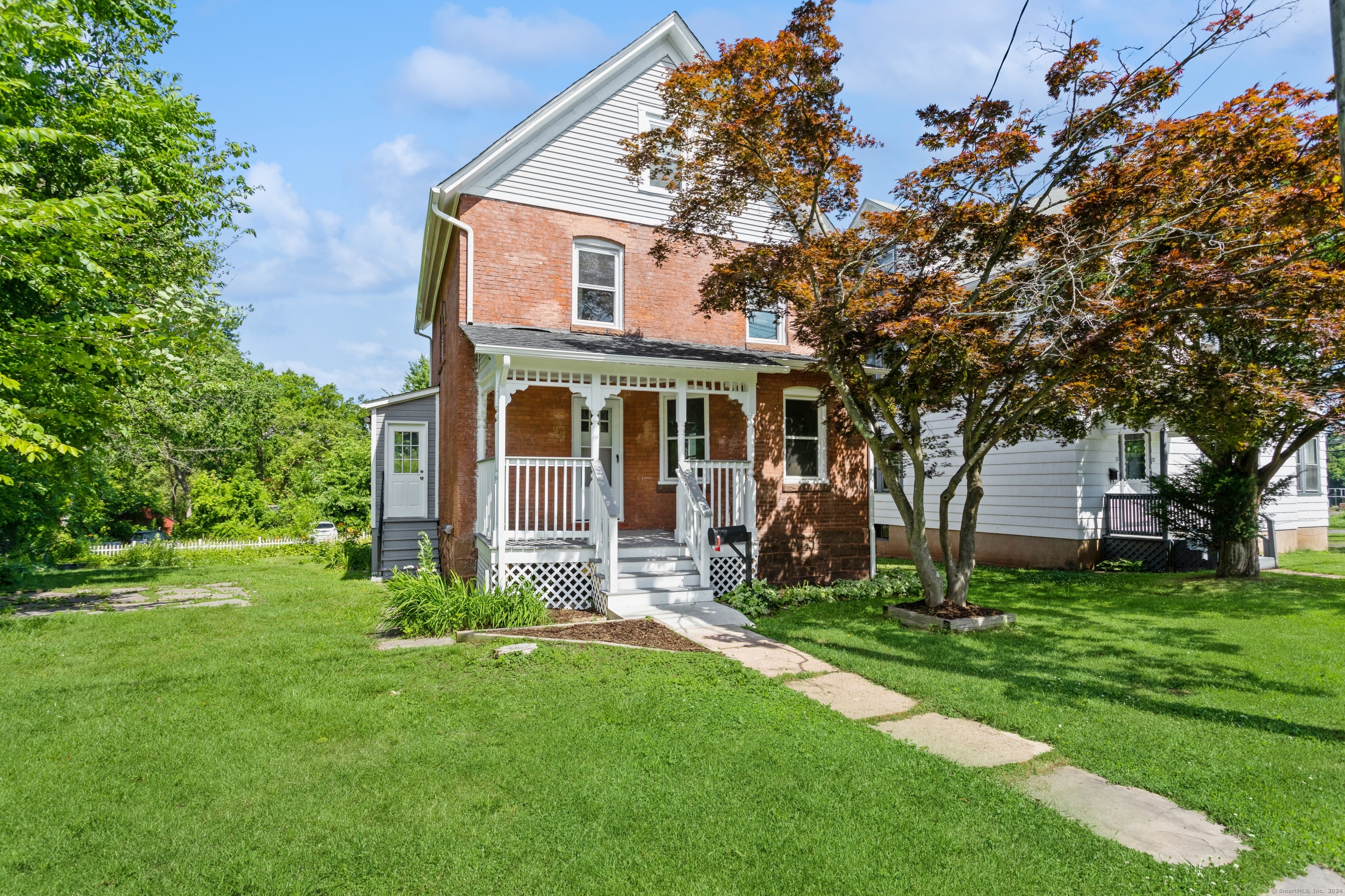 front view of a house with a yard