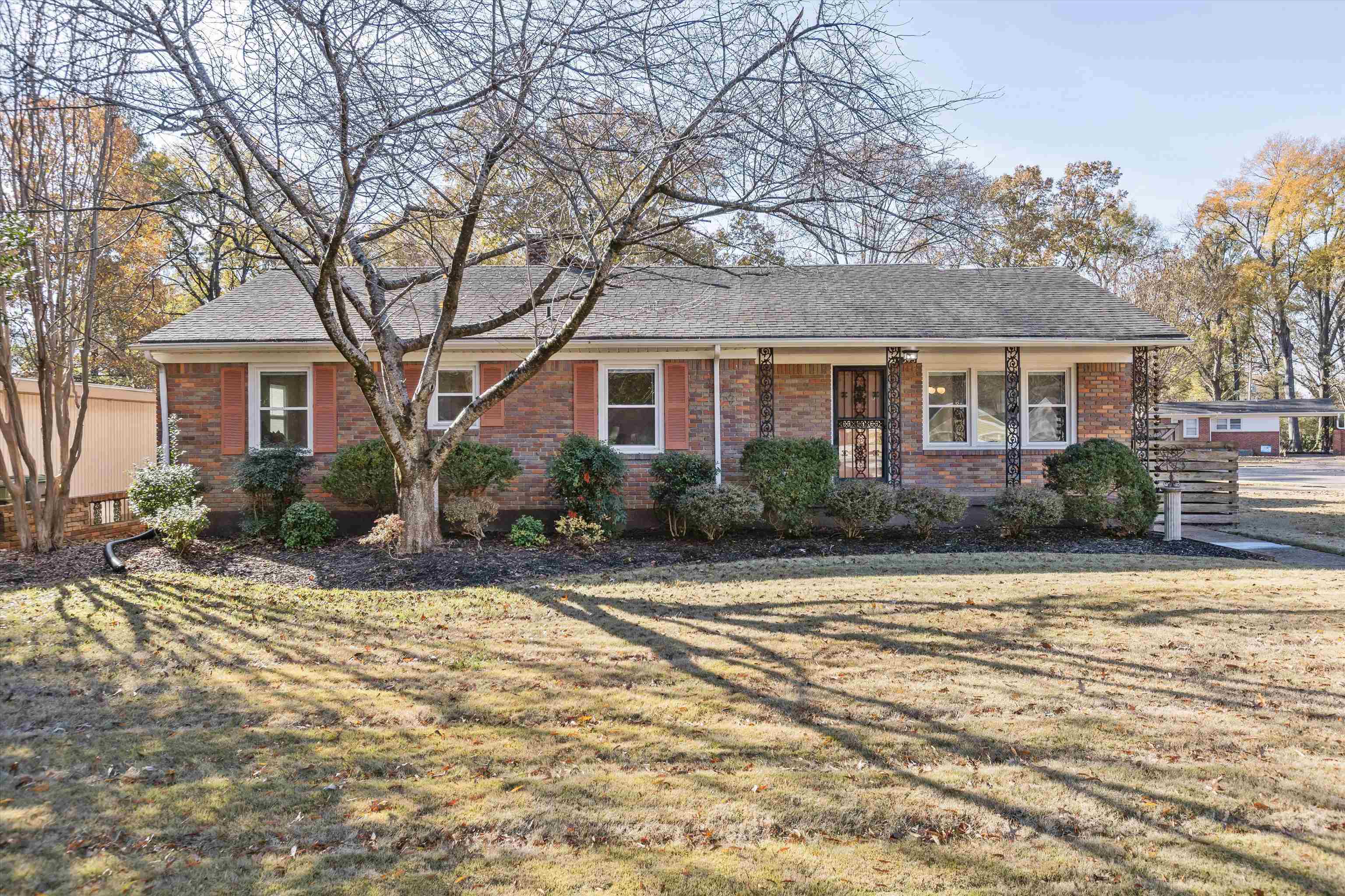 Ranch-style house with a front lawn