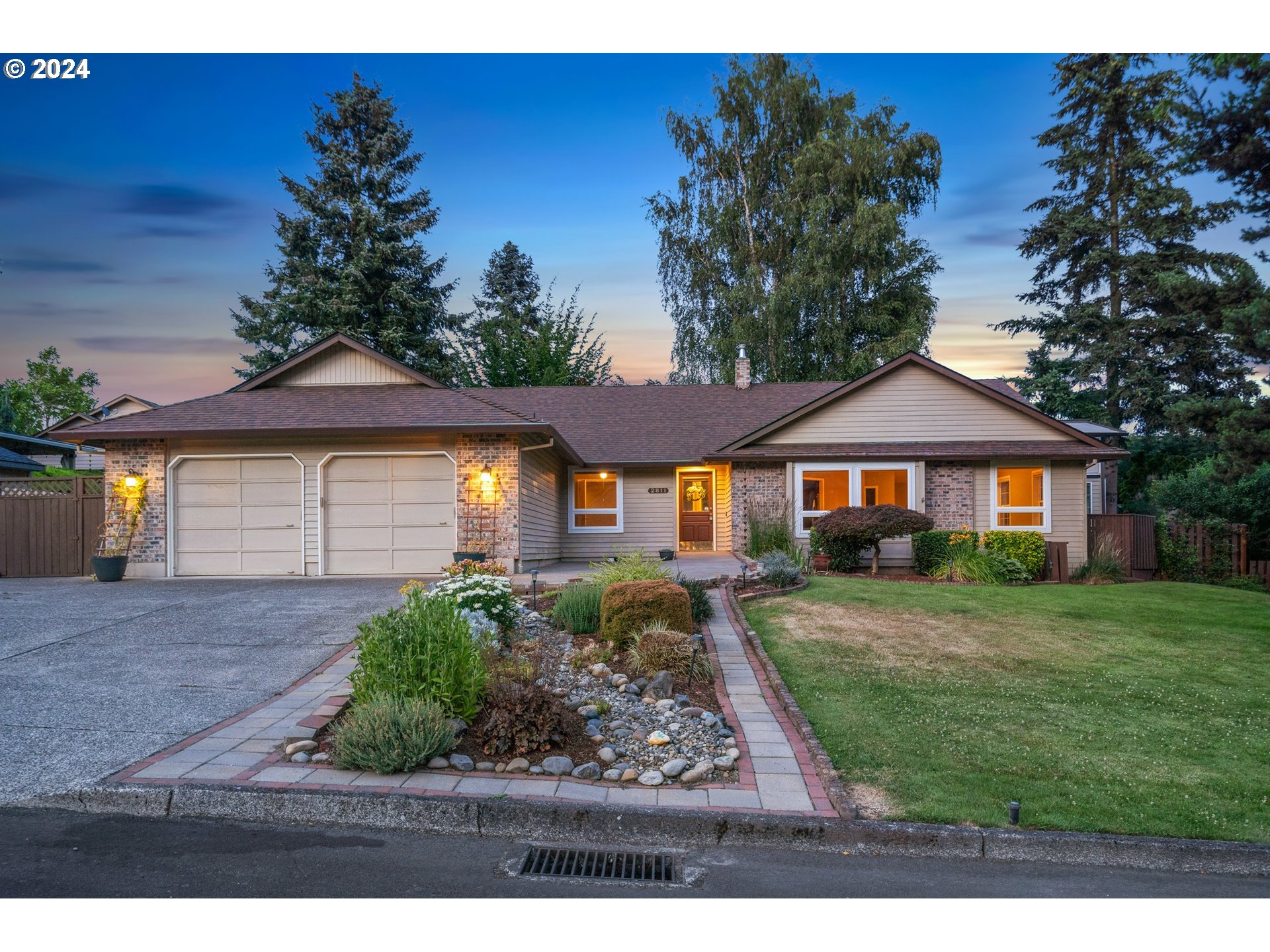 a front view of a house with a yard