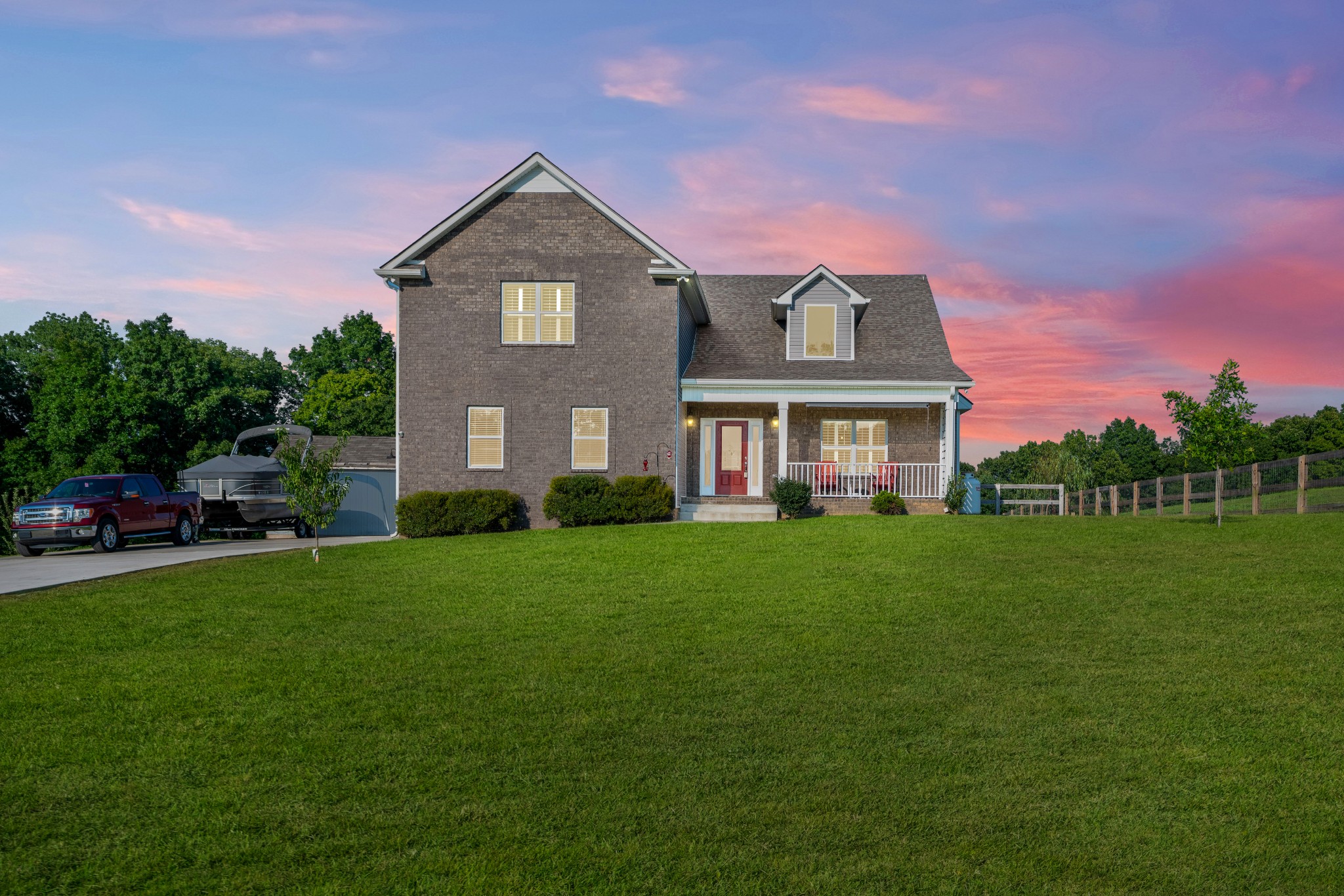 a front view of a house with a yard