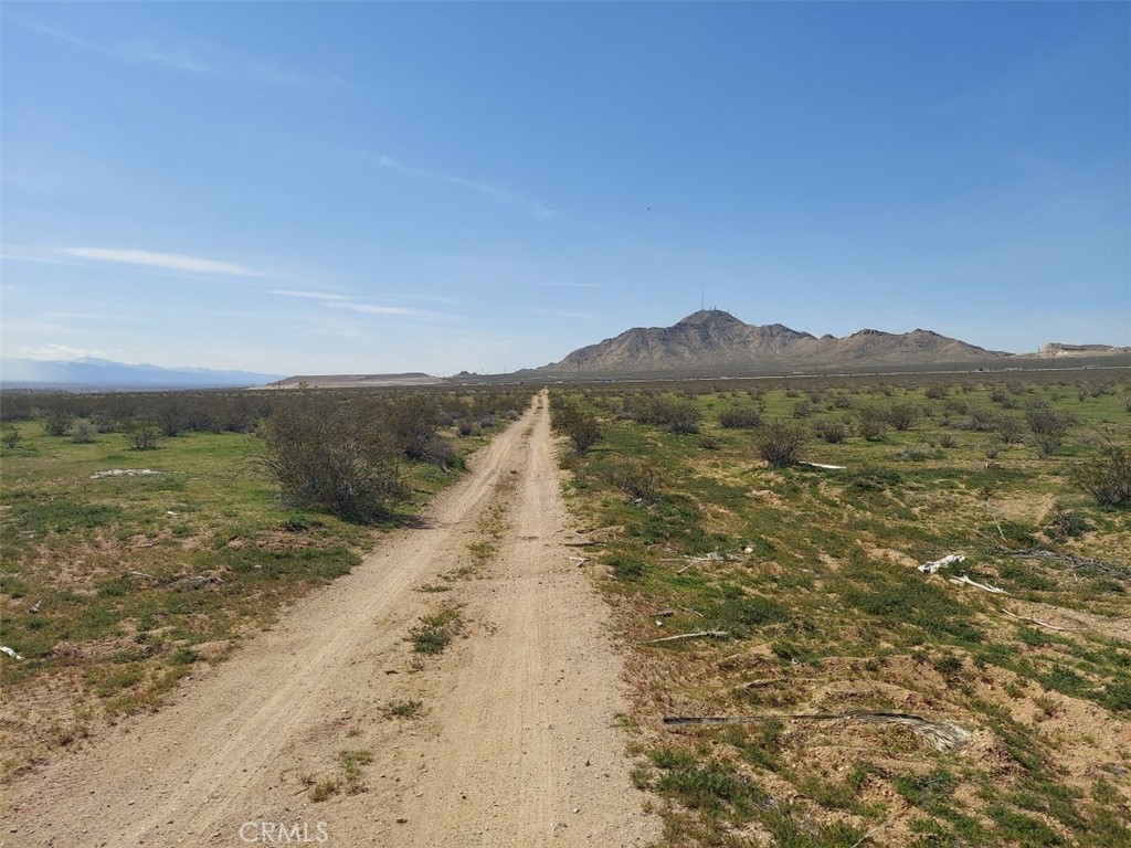 a view of an ocean beach and mountain