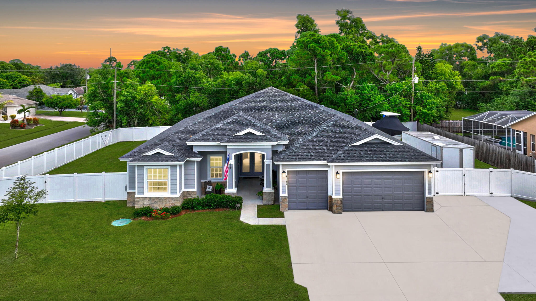 a aerial view of a house with a yard